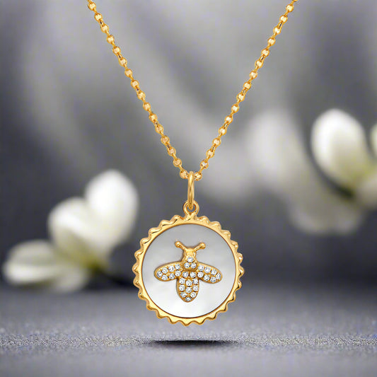 Mother Of Pearl Pendant Accented With A Bee Containing Diamonds