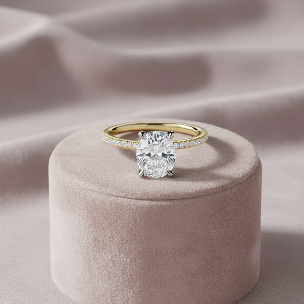 14K Yellow gold mount with an oval lab diamond center in a white head with lab diamond sides