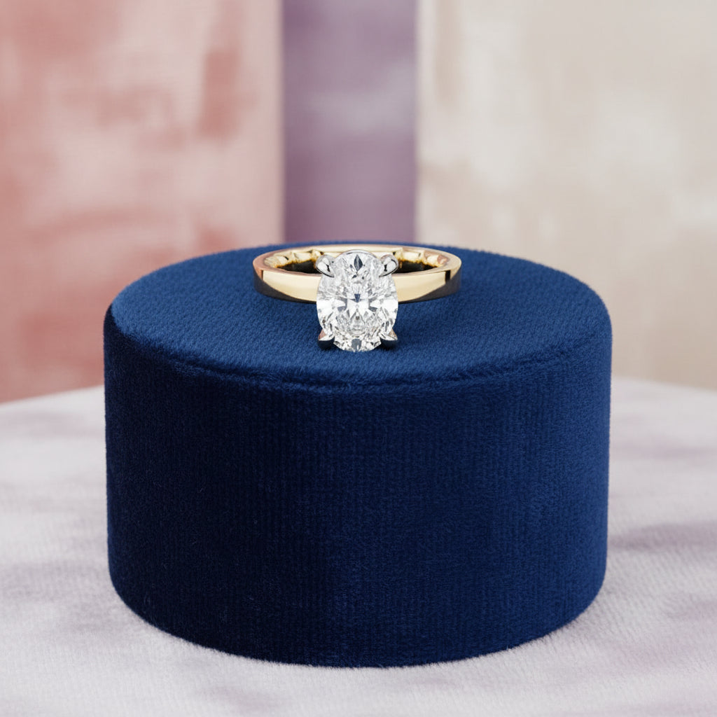 14K Yellow gold solitaire with an oval lab diamond set in a white gold head
