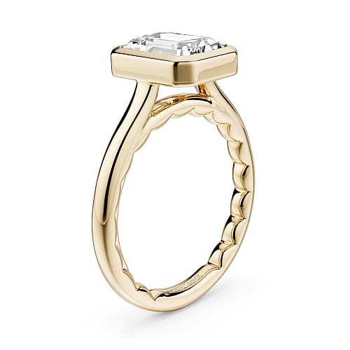 14K Yellow gold solitaire with a bezel set emerald cut lab diamond