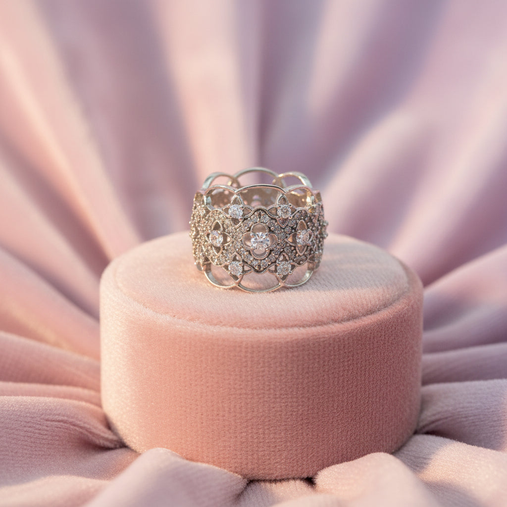 10K WG .06CT I1 G-I CDN DIAMOND CENTER AND ACCENTED WITH .56TW DIAMOND WIDE BAND RING
