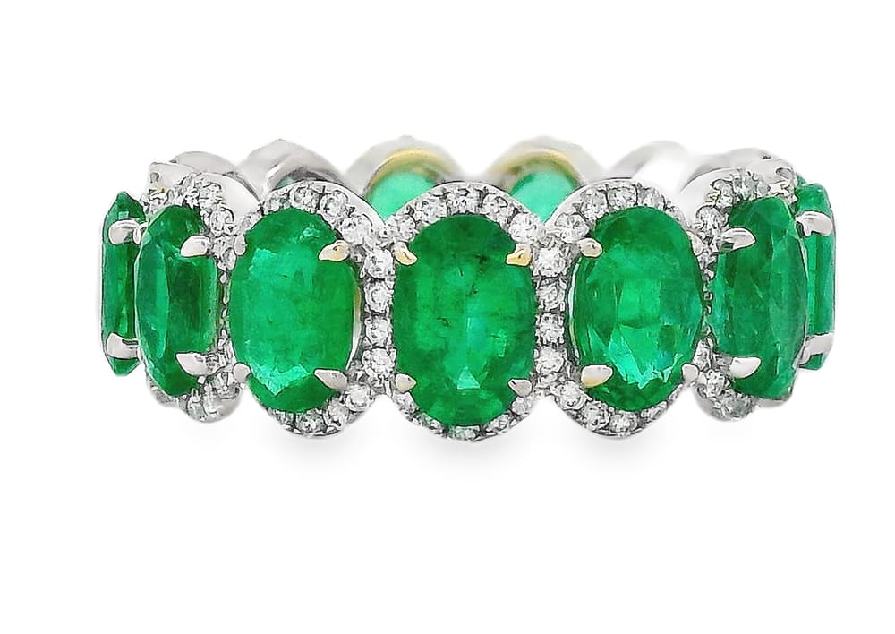 18K WG ETERNITY RING CONTAINING 13=5.52CTW OVAL EMERALDS ACCENTED WITH 182=0.58CTW RD DIAMONDS