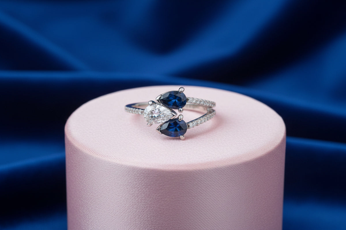 10K WG 0.40CT VS,E-F PEAR SHAPED LAB GROWN DIAMOND RING ACCENTED WITH 2 (6X4MM) BLUE PEAR SHAPED ...