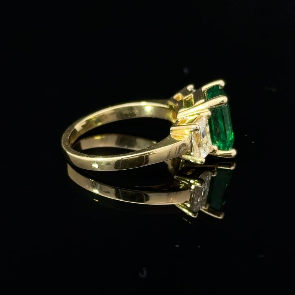 18K Yellow gold octagonal cut emerald and emerald cut Canadian diamond ring