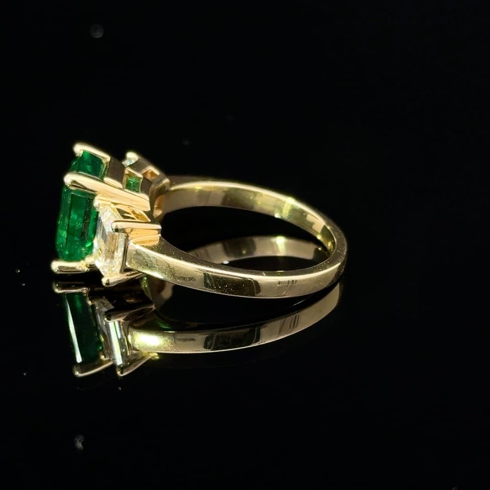 18K Yellow gold octagonal cut emerald and emerald cut Canadian diamond ring