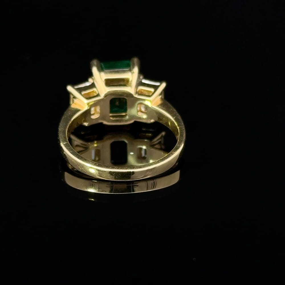 18K Yellow gold octagonal cut emerald and emerald cut Canadian diamond ring