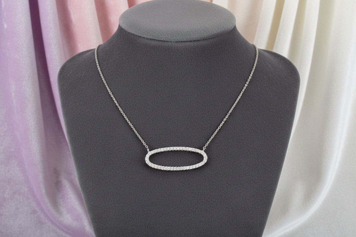 14K WHITE .19TW DIAMOND OVAL NECKLACE