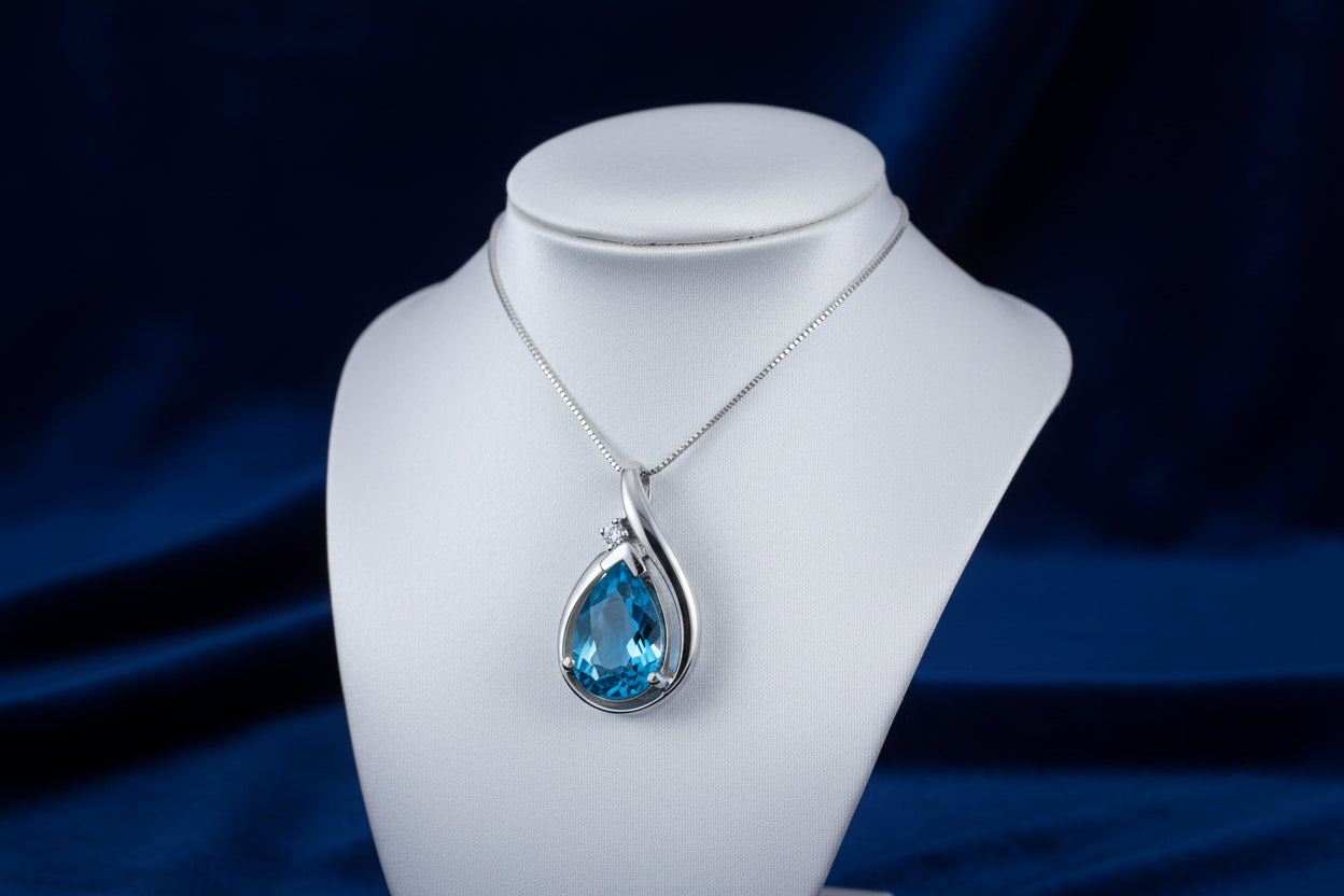 10K WG BLUE TOPAZ PEAR SHAPE WITH 0.015CTW DIAMOND PENDANT