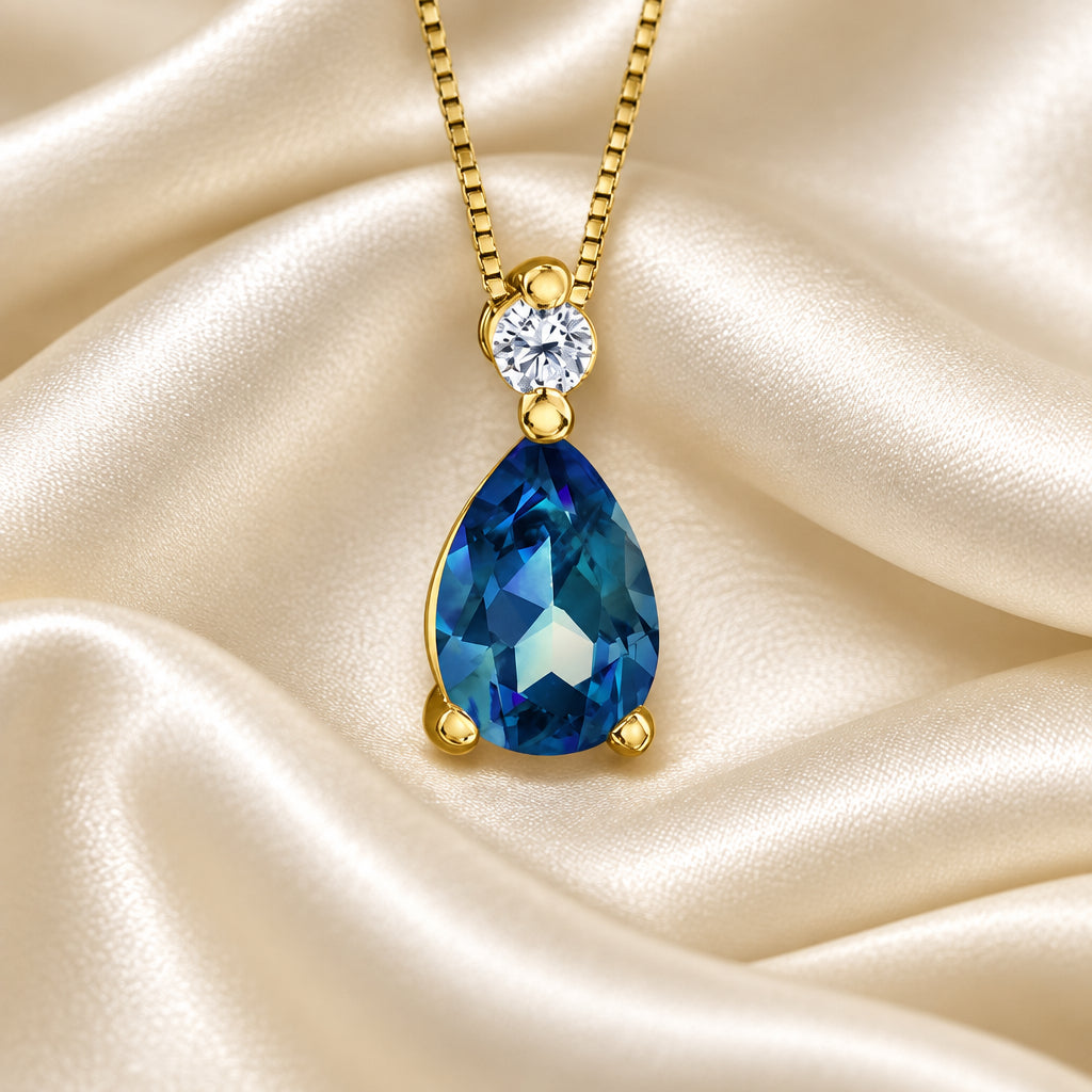 10K Yellow gold pear shape London Blue Topaz and Diamond pendant with chain