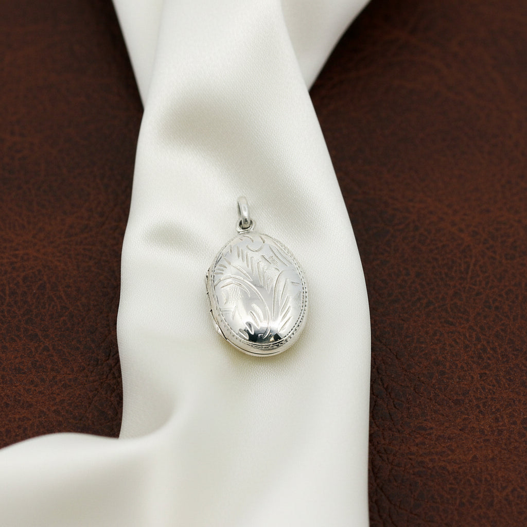 STERLING SILVER RHODIUM PLATED 15.5MM OVAL LOCKET WITH ENGRAVING