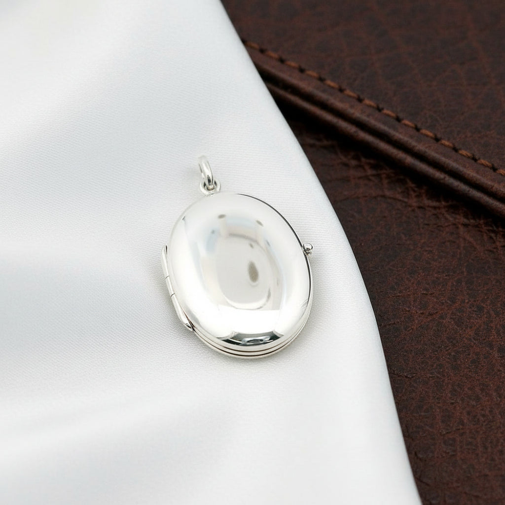 STERLING SILVER RHODIUM PLATED OVAL HIGH POLISH LOCKET