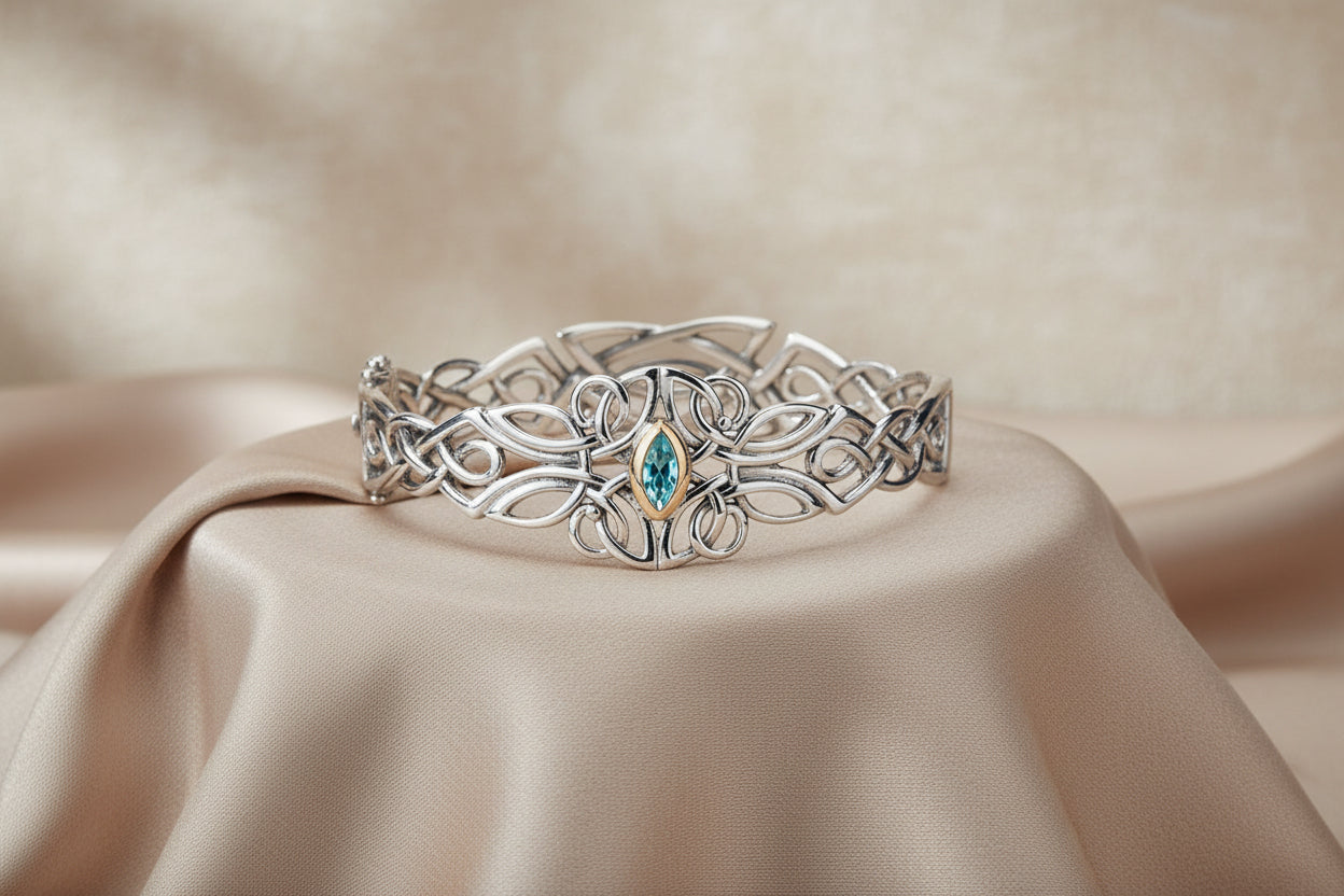 KEITH JACK SS 10K YG BLUE TOPAZ GUARDIAN ANGEL BANGLE