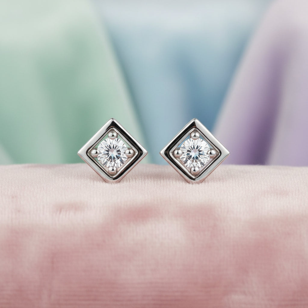 10K WHITE GOLD DIAMOND STUDS. .08TW