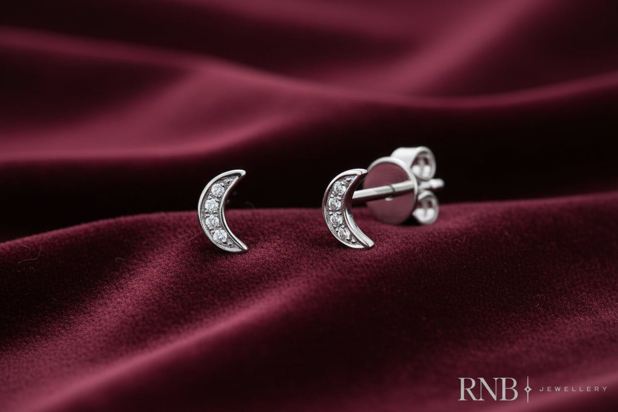 10K WG DIA MOON STUDS8D=.03CTW